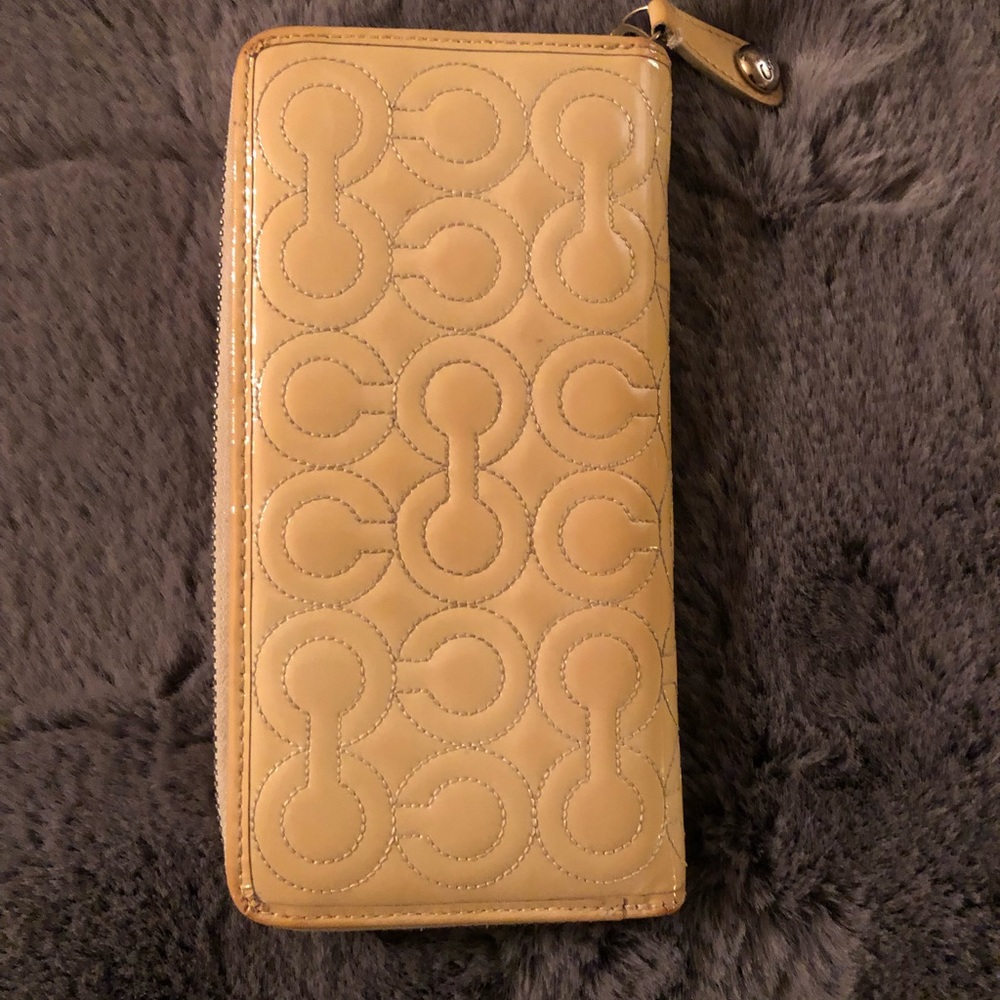 Coach Signature “C” Embossed Wallet.